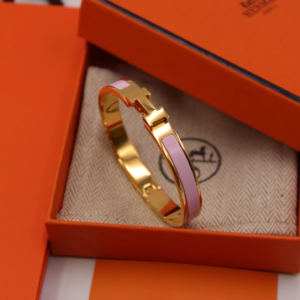 Luxury Gold-Tone Bangle Bracelet with Pink Enamel Inlay
